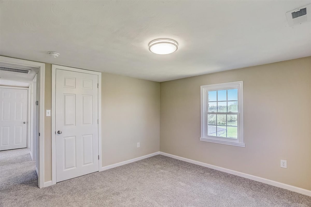 555 White Road Portland, TN 37148 - Photo 17 of 30 an empty room with windows and closet