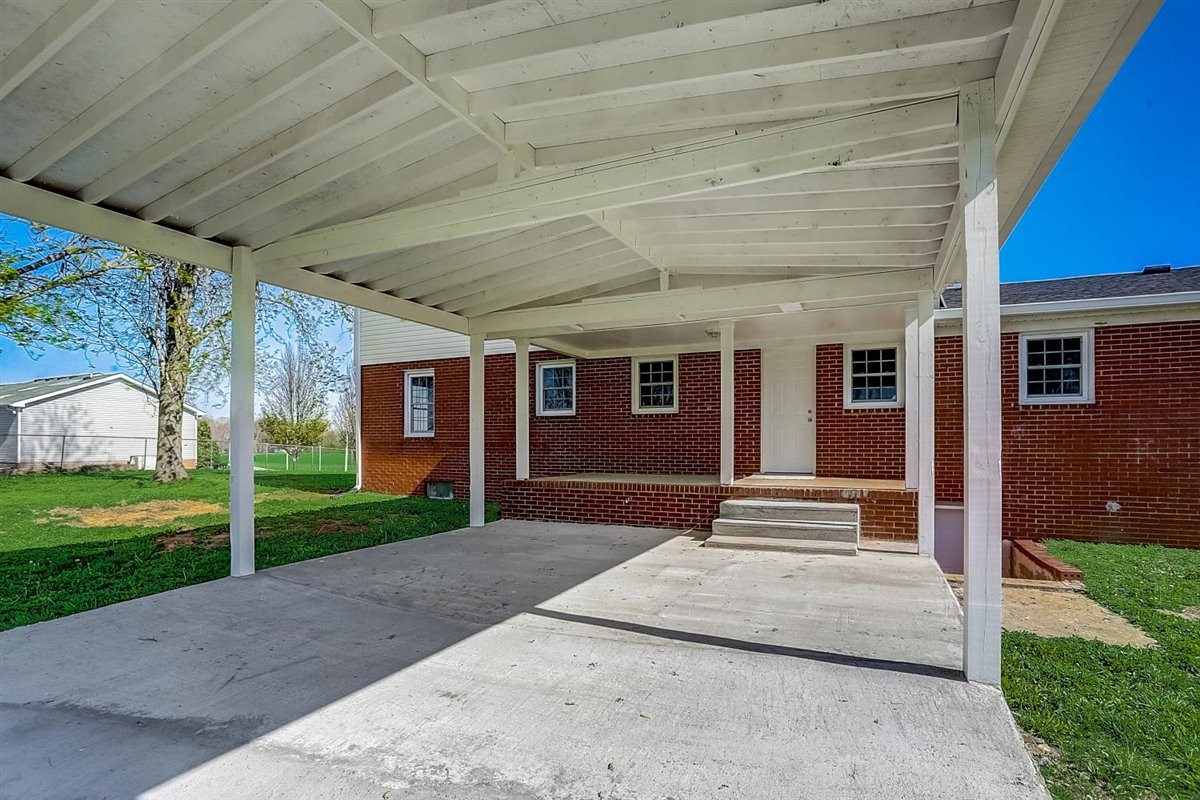 555 White Road Portland, TN 37148 - Photo 25 of 30 a front view of a house with a yard and garage