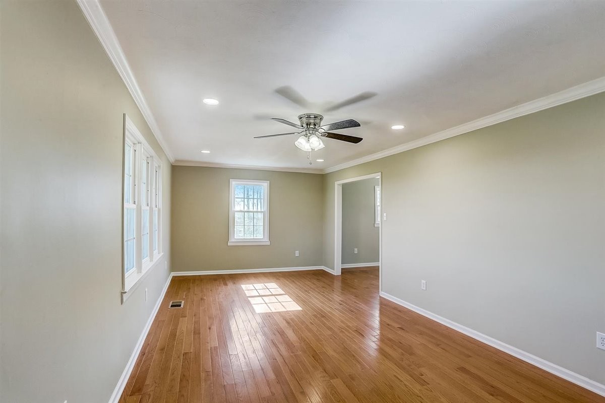 555 White Road Portland, TN 37148 - Photo 5 of 30 an empty room with wooden floor and windows