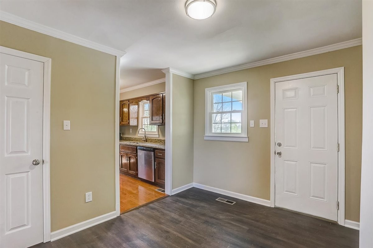 555 White Road Portland, TN 37148 - Photo 8 of 30 an empty room with wooden floor and windows