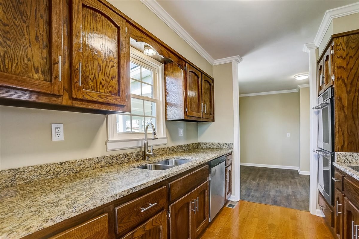 555 White Road Portland, TN 37148 - Photo 10 of 30 a bathroom with a granite countertop sink and a window