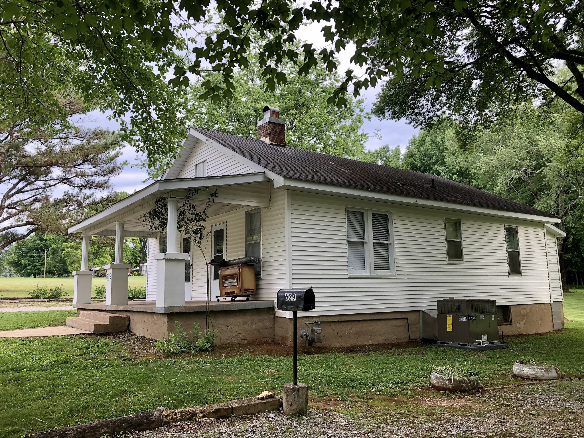 629 A Fall River Road Lawrenceburg, TN 38464 - Photo 36 of 38 a front view of a house with a yard and trees