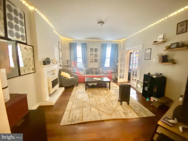 a living room with furniture fireplace and a flat screen tv