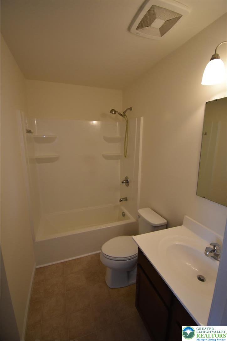 1924 Alex Road Easton, PA 18040 - Photo 17 of 22 a bathroom with a sink a toilet and shower