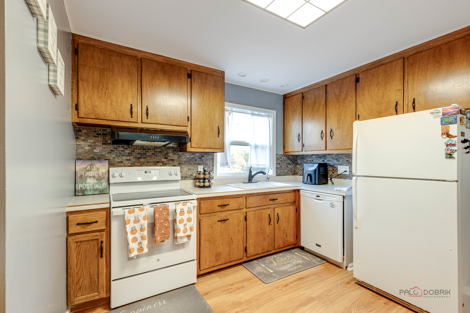 612 Kent Road McHenry, IL 60051 - Photo 7 of 18 a kitchen with stainless steel appliances granite countertop a refrigerator and a stove top oven