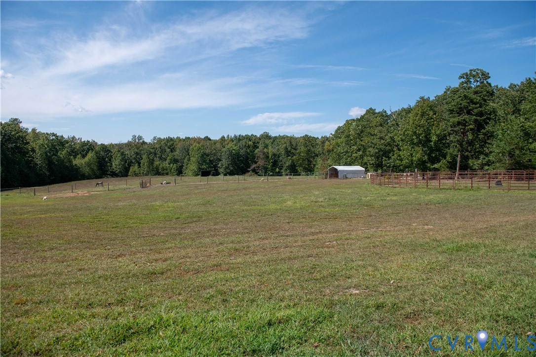 1897 Roundabout Road Louisa, VA 23093 - Photo 23 of 31 a view of a field with trees in the background