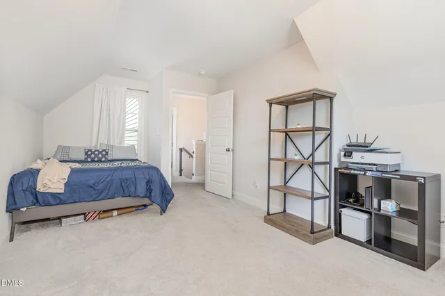 a bedroom with a bed and a table