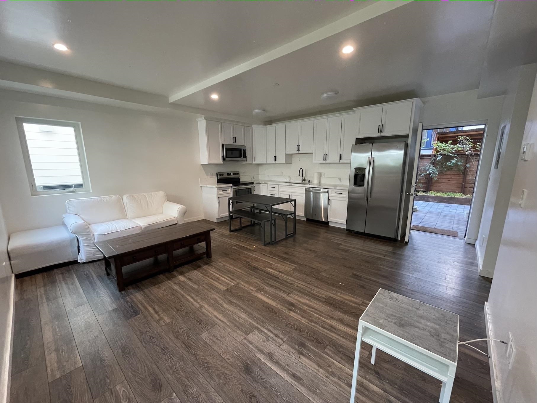 2716 Durant Avenue, Unit B Berkeley, CA 94704 - Photo 3 of 7 a living room with furniture and a wooden floor