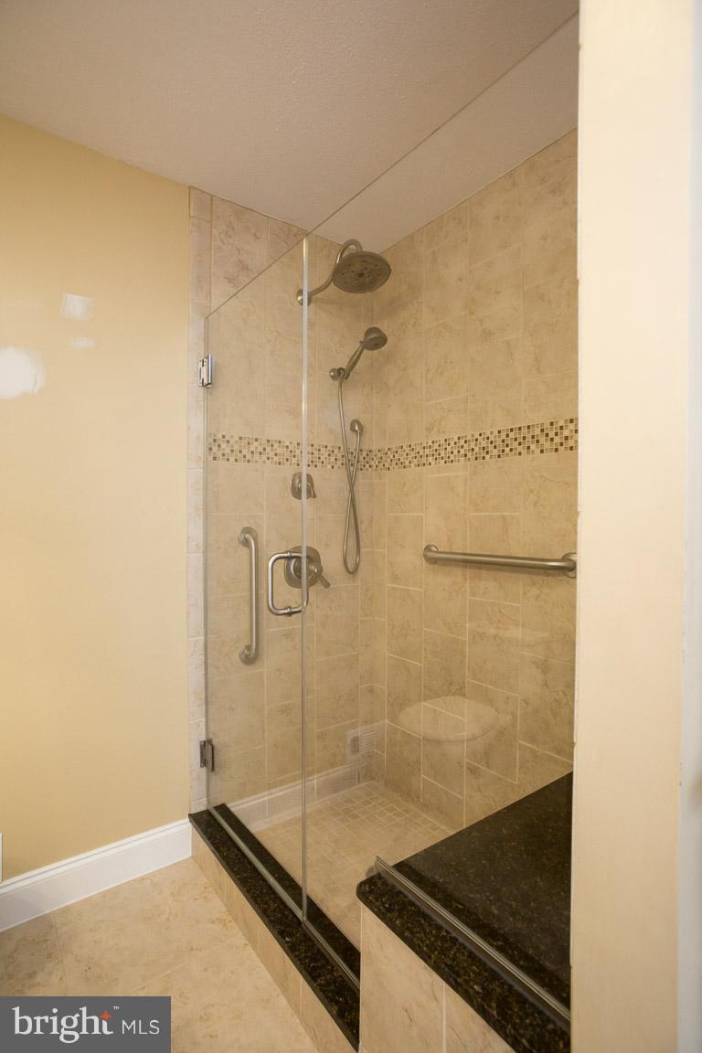 10929 Amherst Avenue, Unit 12 Silver Spring, MD 20902 - Photo 17 of 39 Master Bath shower with sprays and seat