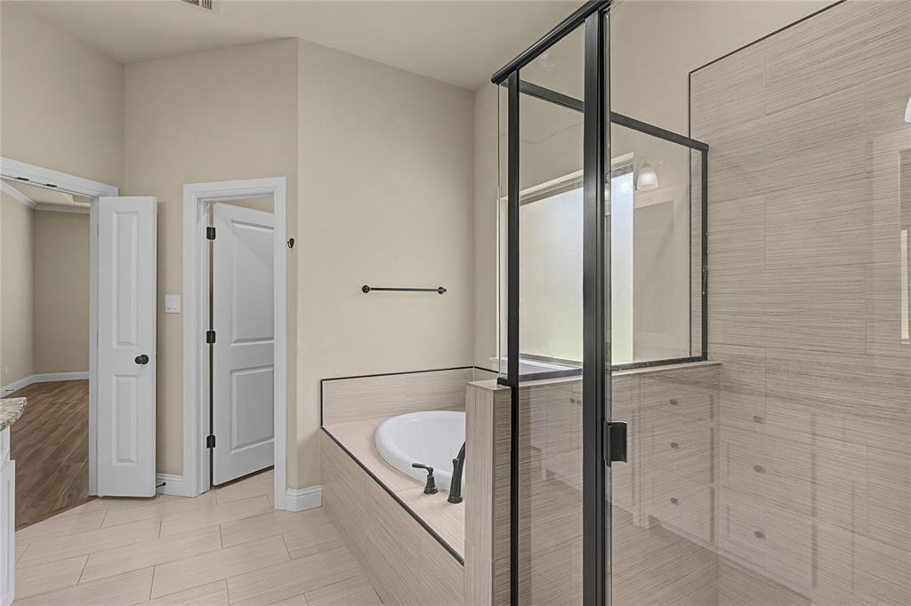 143 Wrigley Drive Springtown, TX 76082 - Photo 27 of 38 Glass shower, deep soaking tub and dedicated water closet
