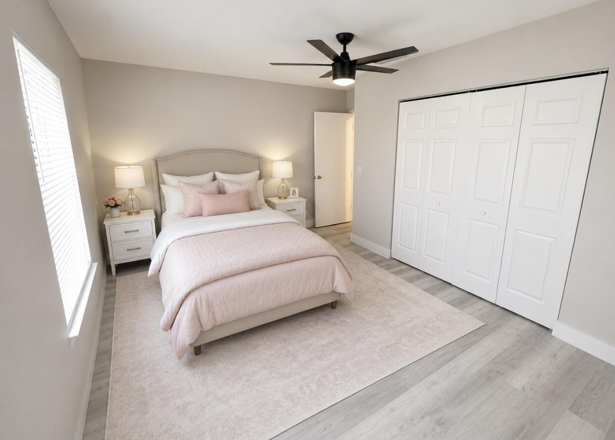 22324 Southwest 57th Circle Boca Raton, FL 33428 - Photo 12 of 22 a bedroom with a bed and a large mirror