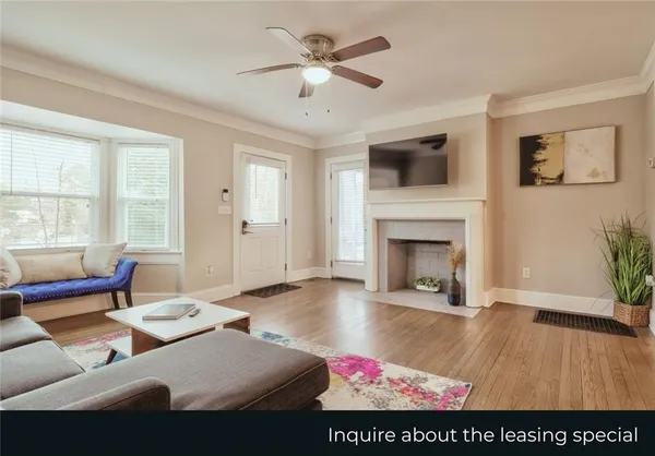 a living room with furniture and a fireplace