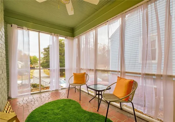 a living room with furniture and a gate