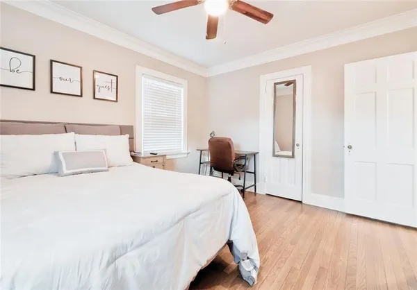 a bedroom with a bed and a chair