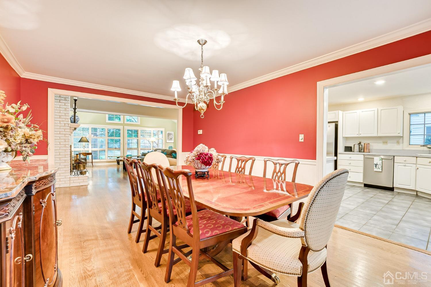 12 Clive Hills Road Edison, NJ 08820 - Photo 24 of 65 a view of a dining room with furniture and a chandelier