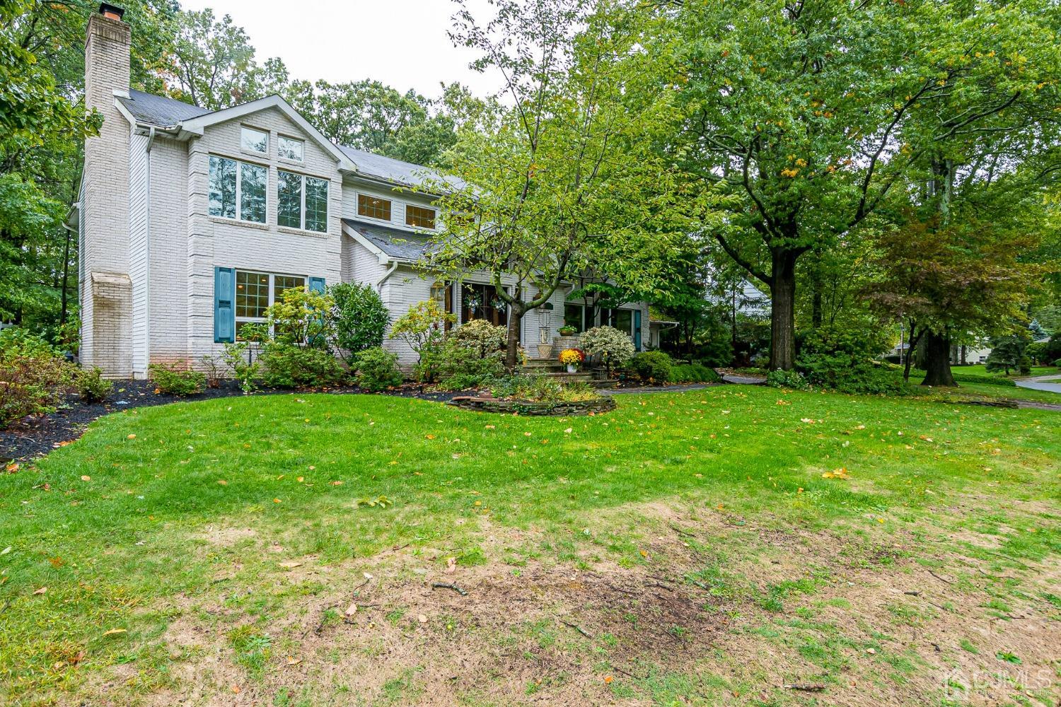 12 Clive Hills Road Edison, NJ 08820 - Photo 4 of 65 a front view of house with yard and green space