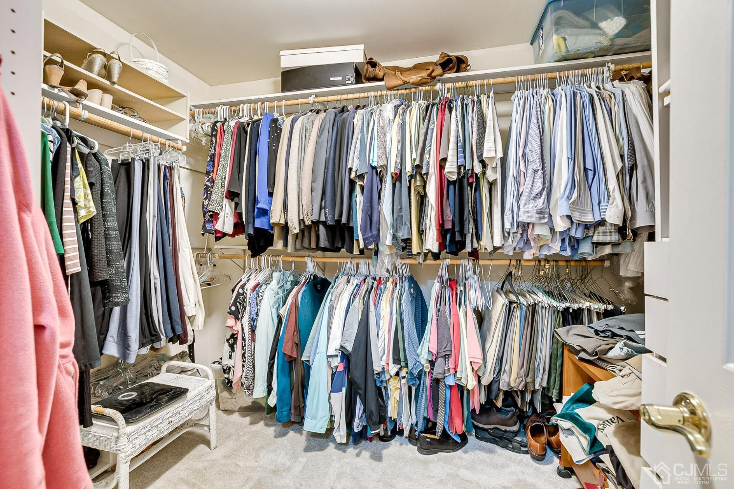 12 Clive Hills Road Edison, NJ 08820 - Photo 47 of 65 a view of walk in closet with clothes