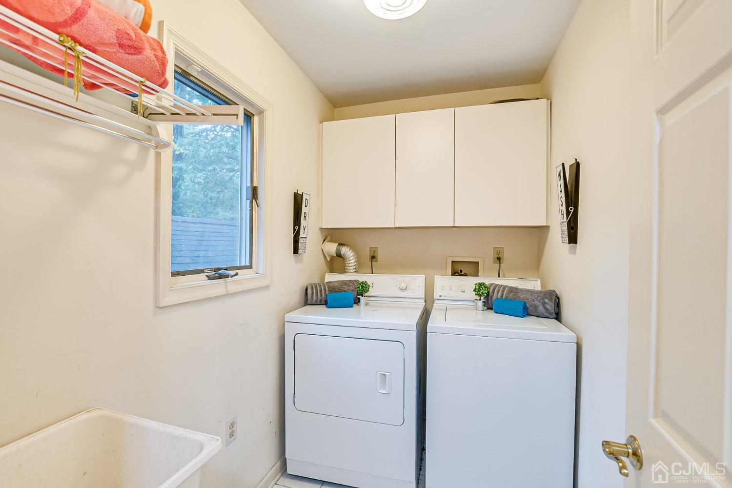 12 Clive Hills Road Edison, NJ 08820 - Photo 48 of 65 a view of bathroom with a sink cabinet and a window