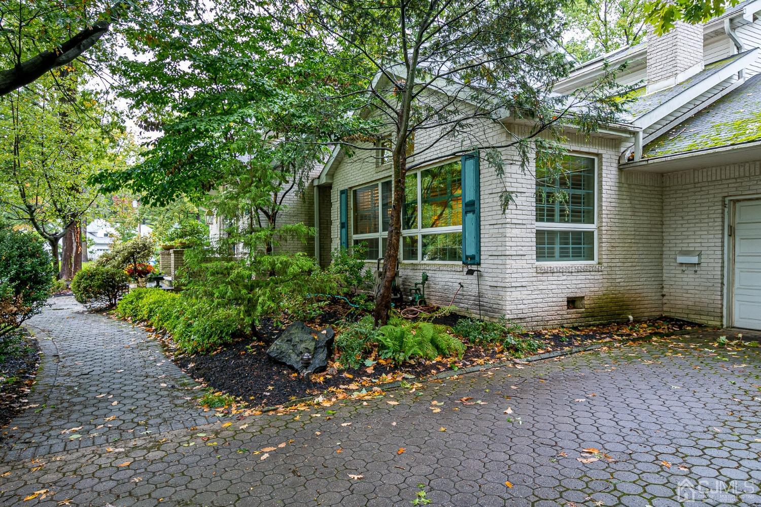 12 Clive Hills Road Edison, NJ 08820 - Photo 5 of 65 a front view of a house with garden