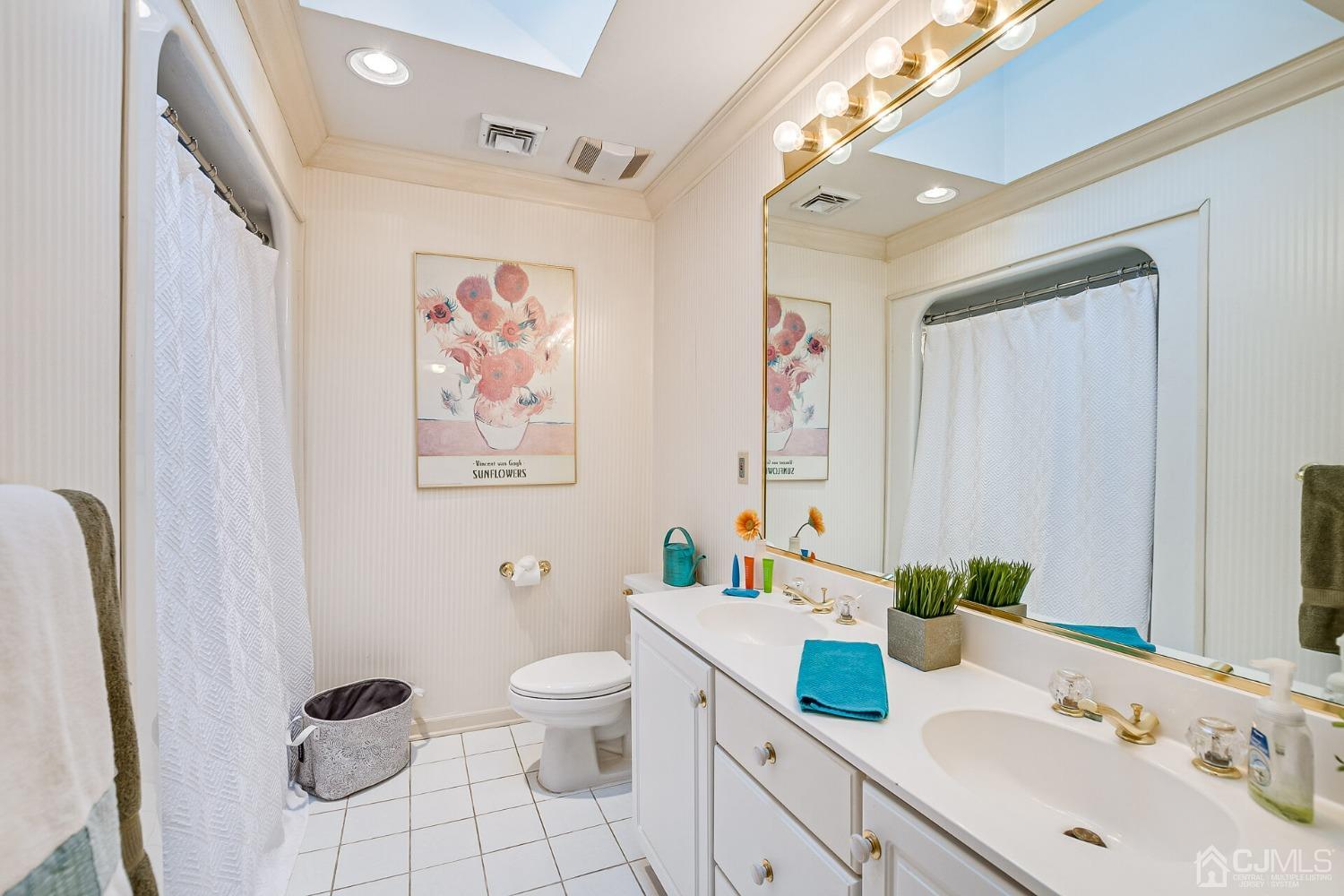 12 Clive Hills Road Edison, NJ 08820 - Photo 54 of 65 a bathroom with a granite countertop toilet sink and mirror