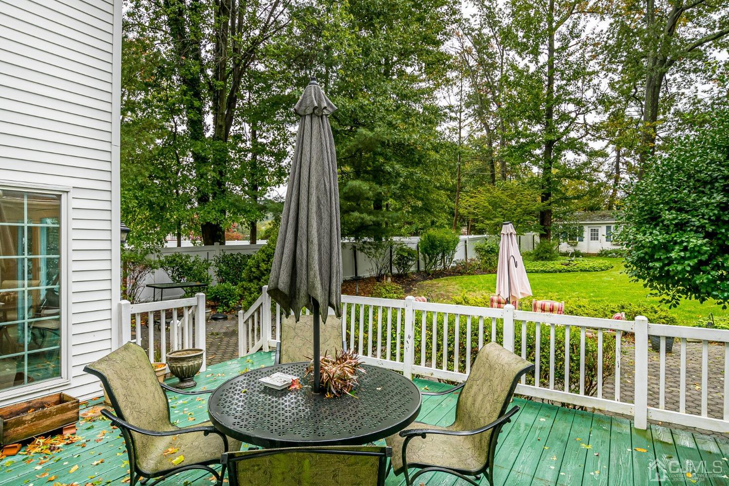 12 Clive Hills Road Edison, NJ 08820 - Photo 57 of 65 a view of a deck with a table and chairs