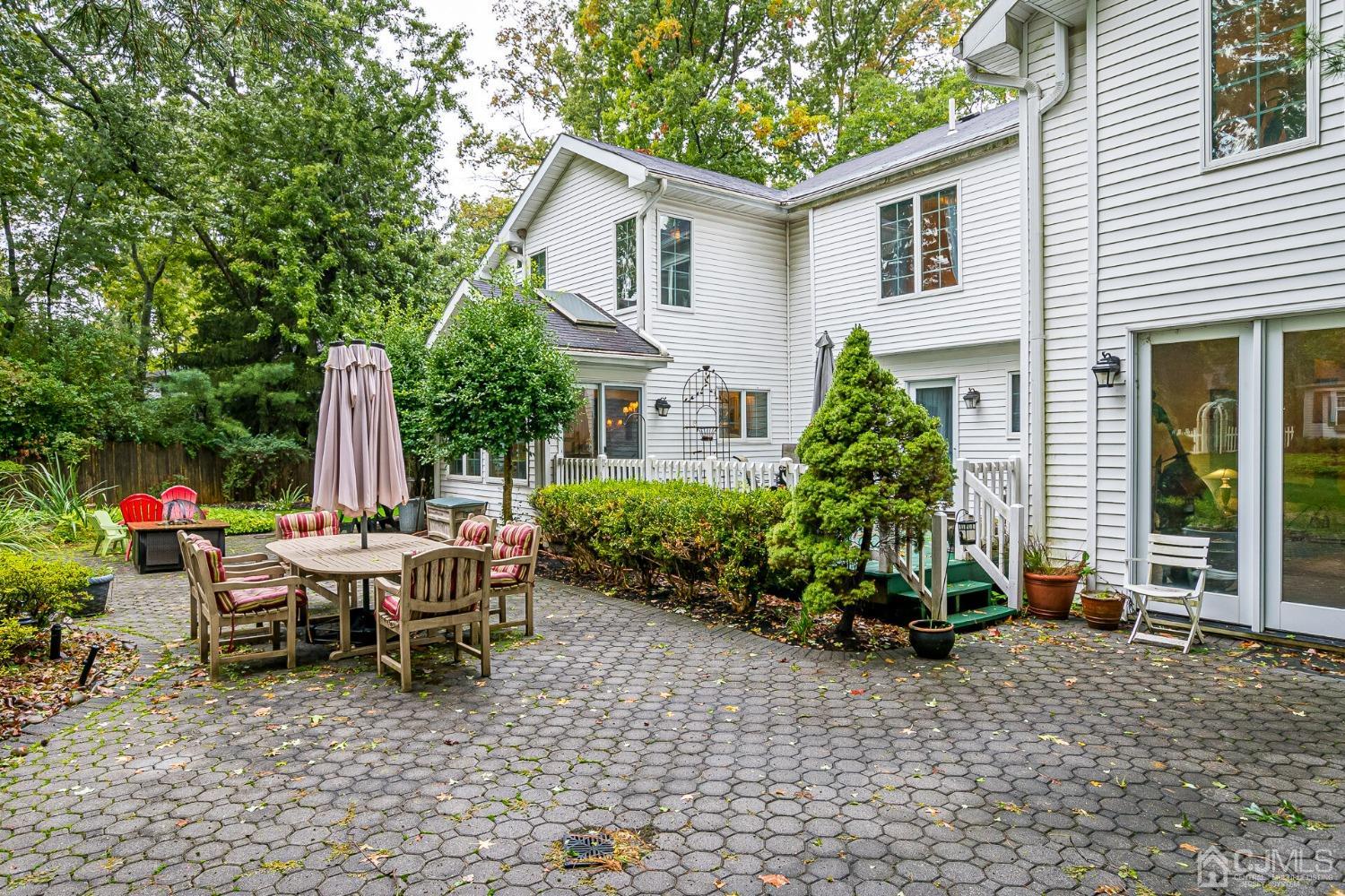 12 Clive Hills Road Edison, NJ 08820 - Photo 58 of 65 a view of a house with backyard and sitting area