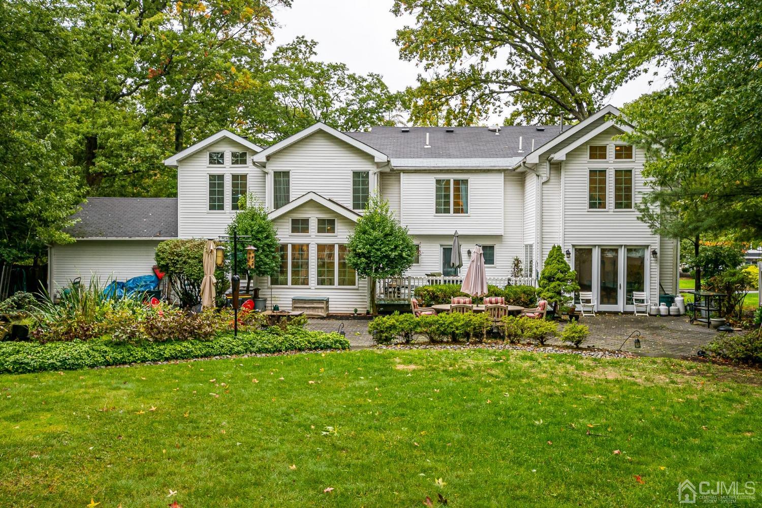 12 Clive Hills Road Edison, NJ 08820 - Photo 60 of 65 a front view of house with yard and outdoor seating