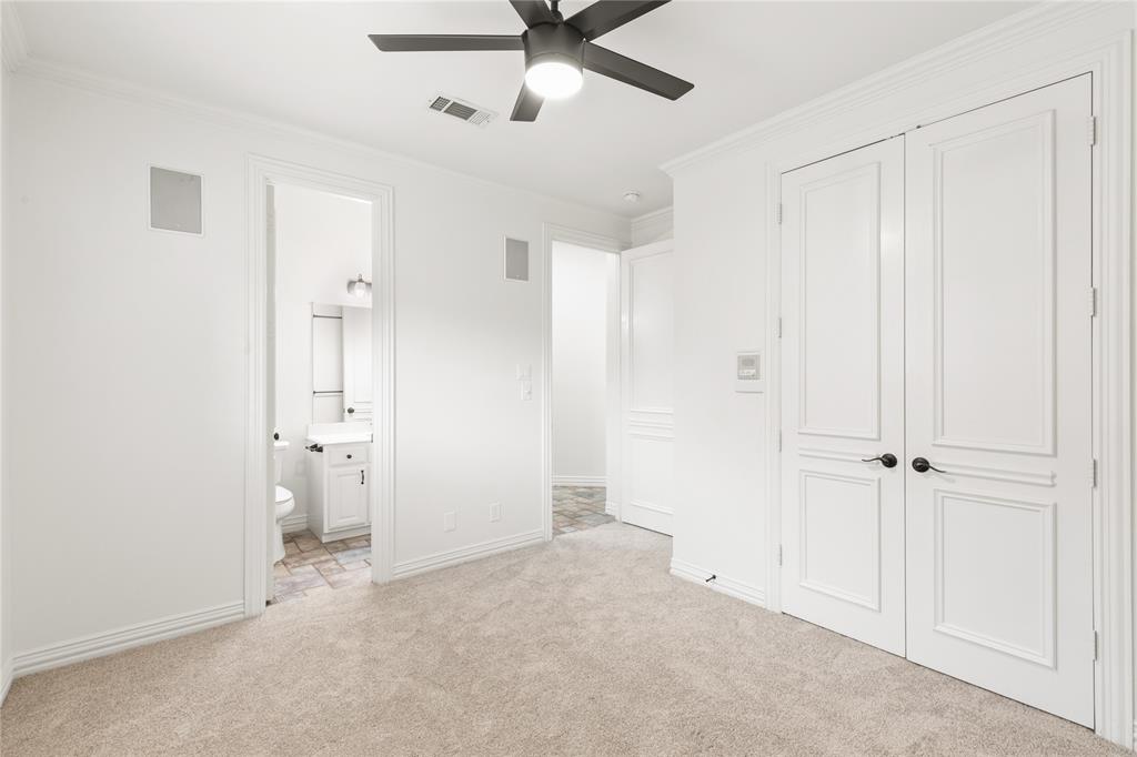 967 East Bethel School Road Coppell, TX 75019 - Photo 19 of 39 Plush neutral carpet flooring and white walls, featuring a ceiling fan with integrated lighting