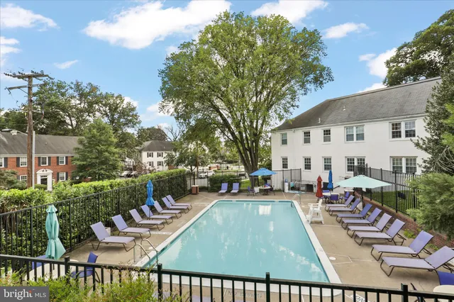 a view of a house with backyard porch and sitting area