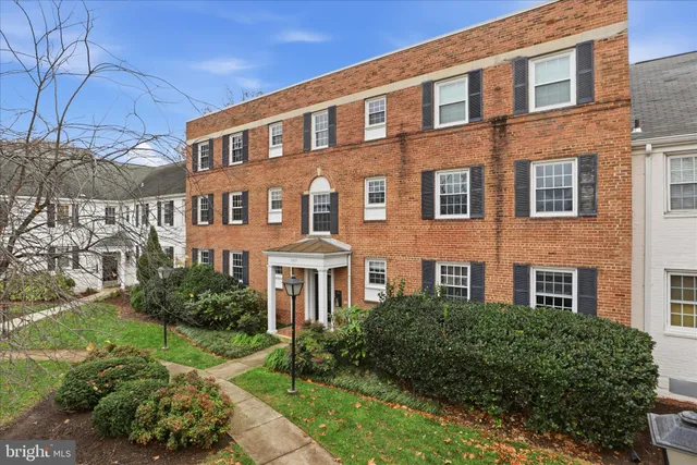 a front view of a building with garden