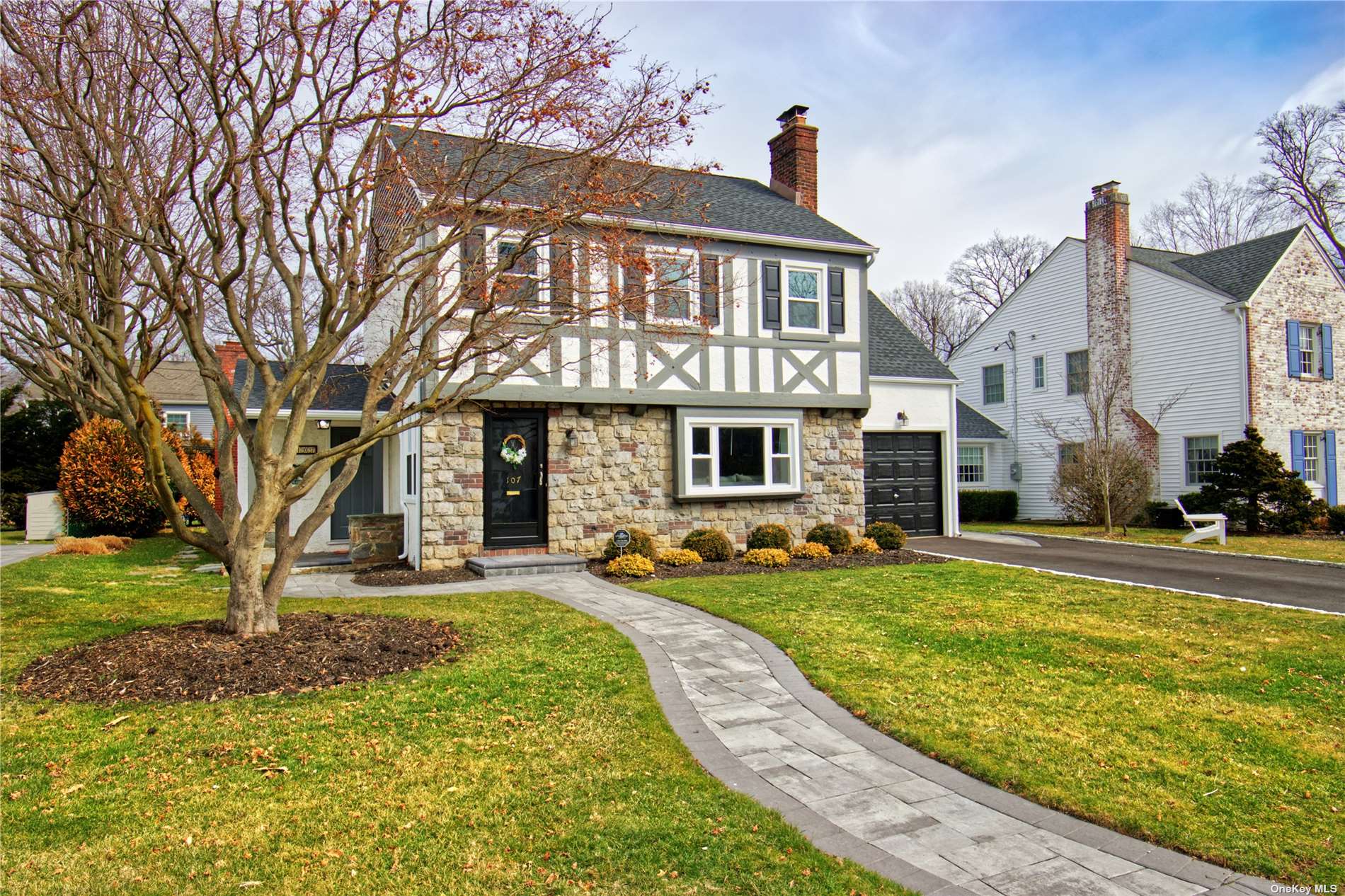 a front view of a house with a yard table and chairs
