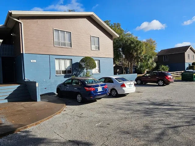 a view of a car parked in front of a house