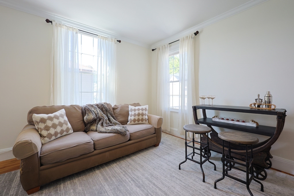 107 Minot Street Boston, MA 02122 - Photo 18 of 42 a living room with furniture and a window