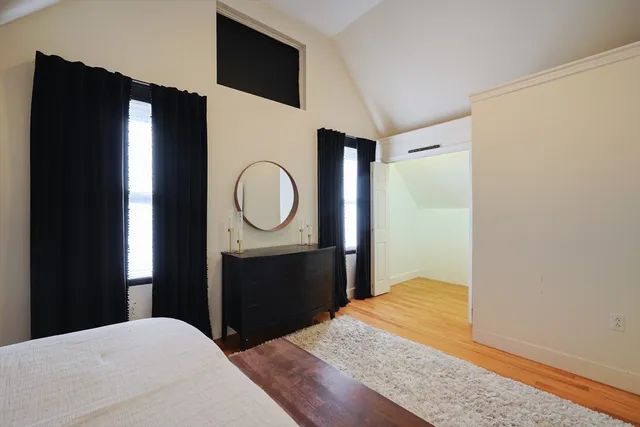 a bedroom with a bed and a dresser