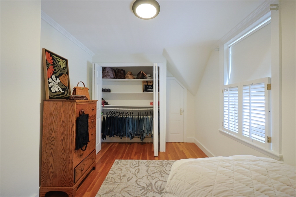107 Minot Street Boston, MA 02122 - Photo 29 of 42 a bedroom with a bed and a fireplace