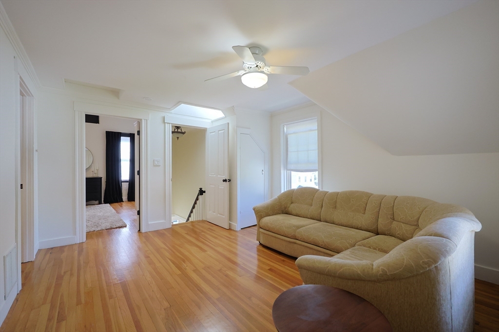 107 Minot Street Boston, MA 02122 - Photo 35 of 42 a living room with furniture and a wooden floor
