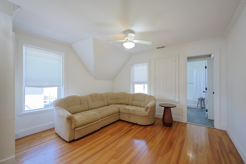 107 Minot Street Boston, MA 02122 - Photo 36 of 42 a living room with furniture and a wooden floor