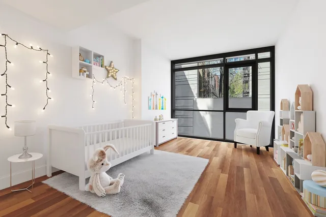 a living room with furniture or wooden floor and a large window