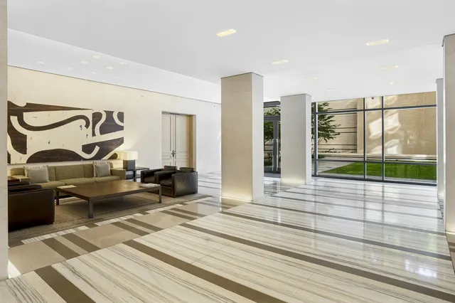 a living room with lots of furniture and a flat screen tv