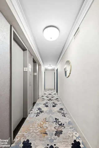 a view of a hallway to a bedroom
