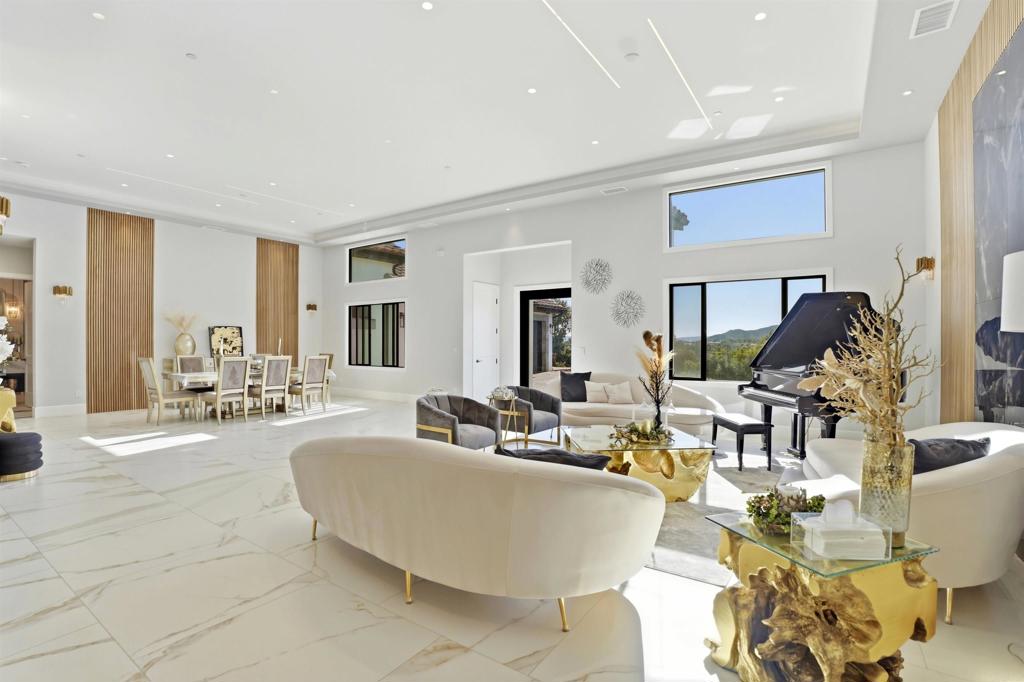 14989 Orchard View Drive Poway, CA 92064 - Photo 11 of 50 a living room with fireplace furniture and a flat screen tv
