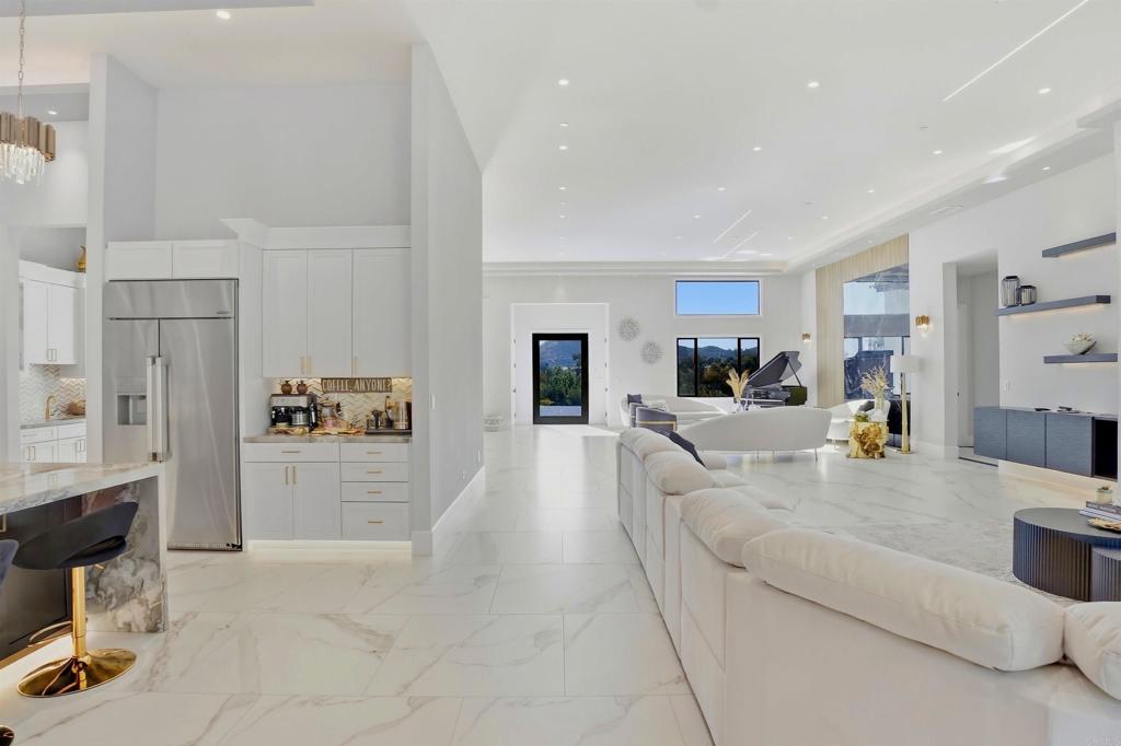 14989 Orchard View Drive Poway, CA 92064 - Photo 15 of 50 a living room with furniture and a kitchen