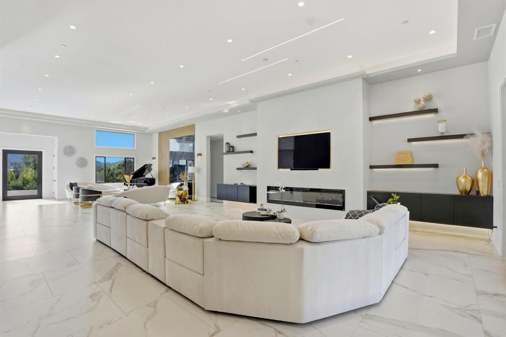 14989 Orchard View Drive Poway, CA 92064 - Photo 16 of 50 a living room with furniture and a flat screen tv