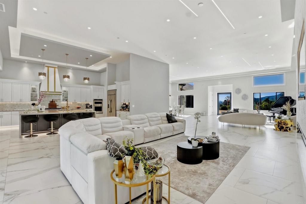 14989 Orchard View Drive Poway, CA 92064 - Photo 17 of 50 a living room with furniture and kitchen view