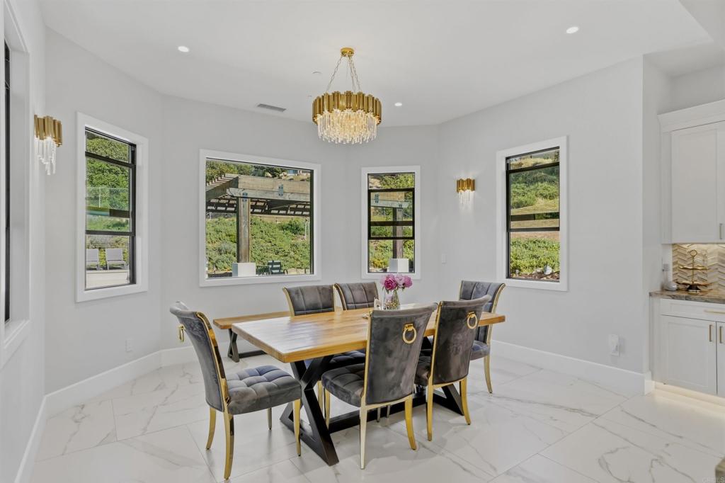 14989 Orchard View Drive Poway, CA 92064 - Photo 22 of 50 a view of a dining room with furniture and chandelier