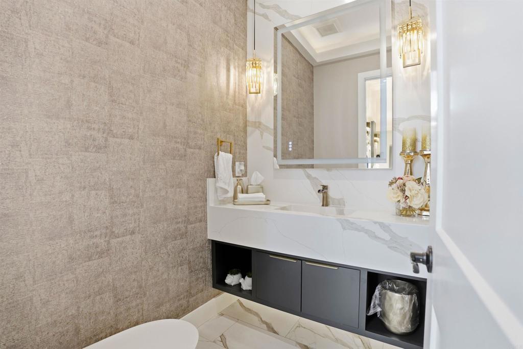 14989 Orchard View Drive Poway, CA 92064 - Photo 25 of 50 a bathroom with a sink a toilet and a mirror