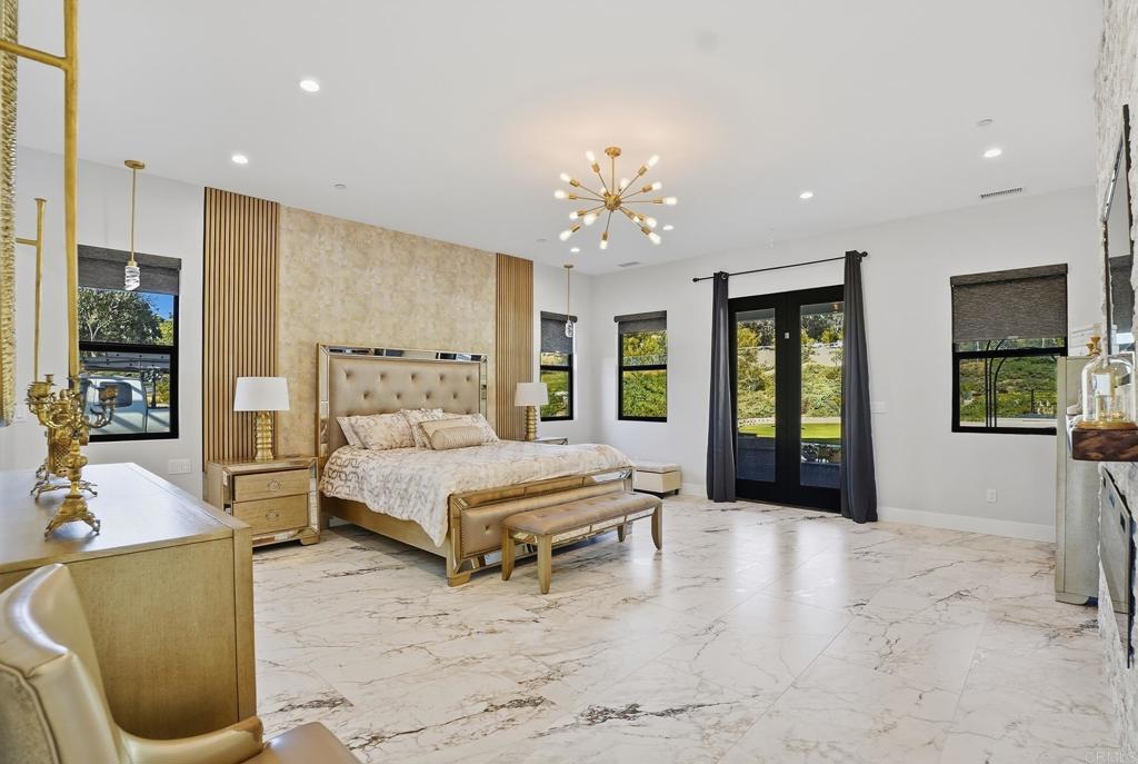 14989 Orchard View Drive Poway, CA 92064 - Photo 26 of 50 a spacious bedroom with a large bed and a couch