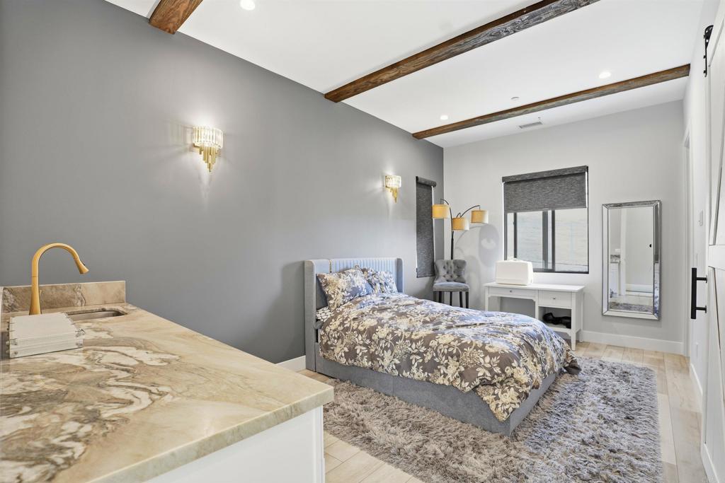 14989 Orchard View Drive Poway, CA 92064 - Photo 30 of 50 a bedroom with a bed and a dresser with mirror