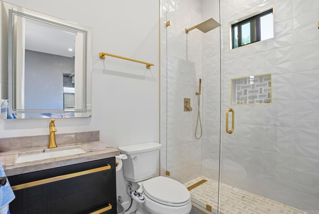 14989 Orchard View Drive Poway, CA 92064 - Photo 33 of 50 a bathroom with a sink a toilet and shower