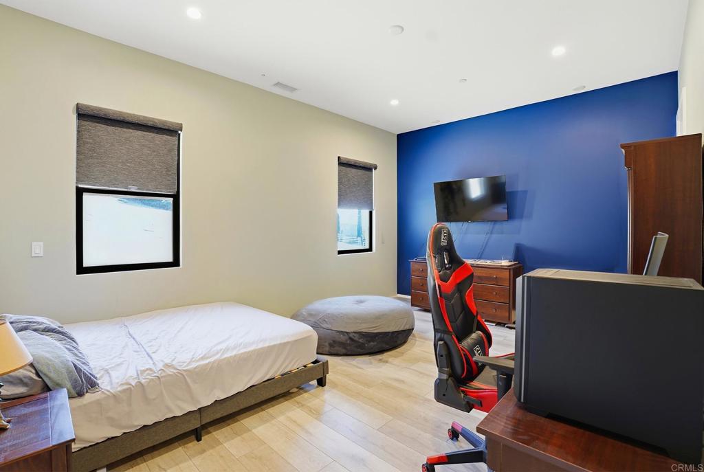 14989 Orchard View Drive Poway, CA 92064 - Photo 34 of 50 a bedroom with bed and a flat screen tv